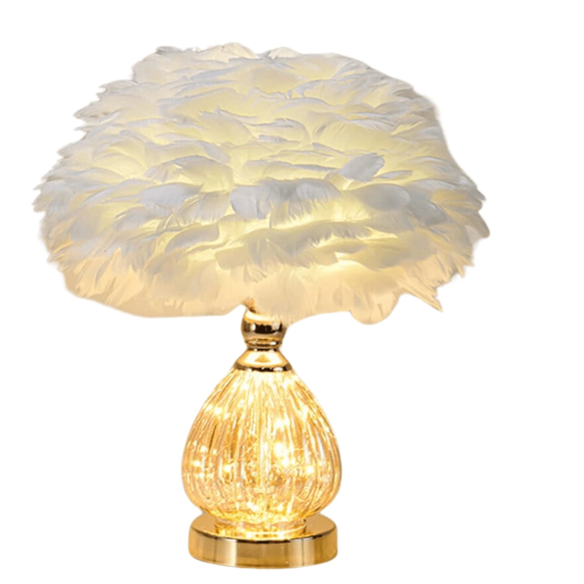 Lampe de table en plumes d'autruche avec base dorée, créant un éclairage luxueux et élégant pour une ambiance raffinée.