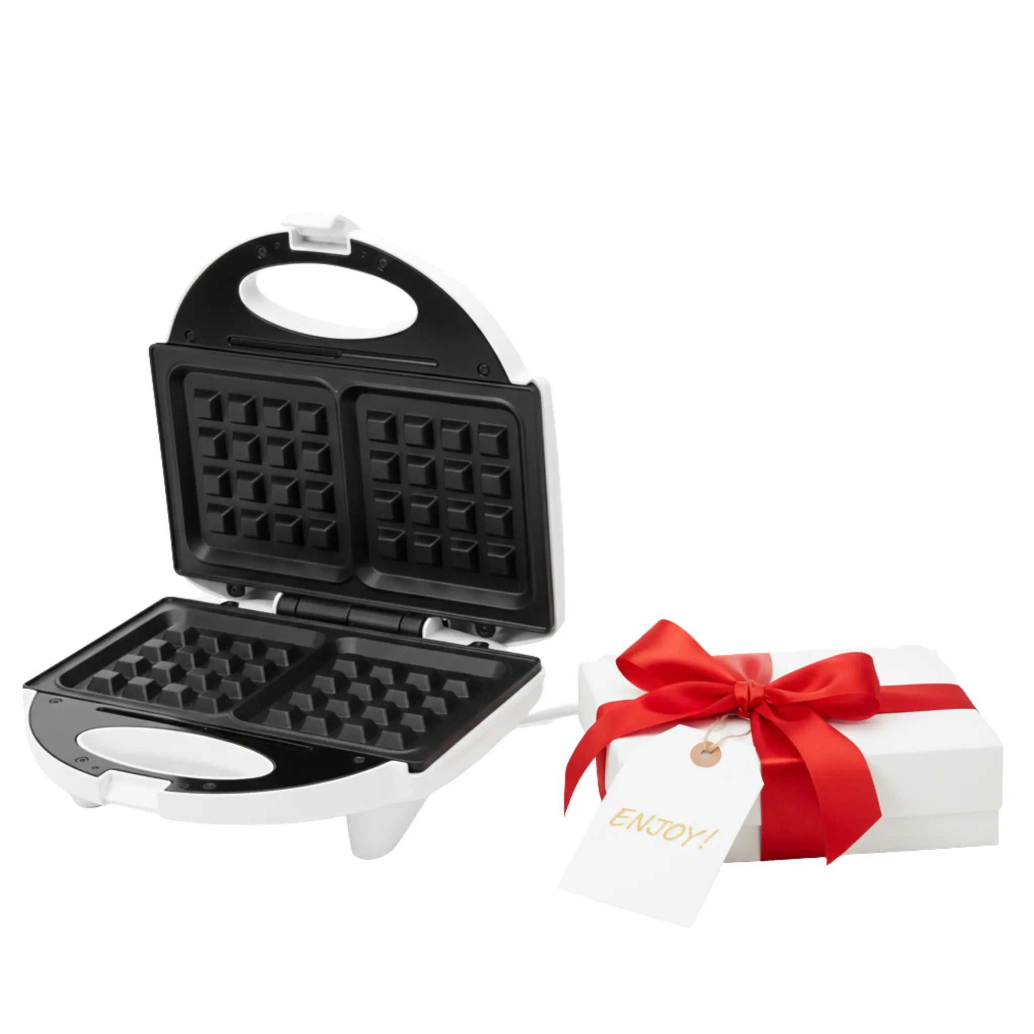 Boîte cadeau rouge avec ruban posée à côté d’un appareil de cuisine.