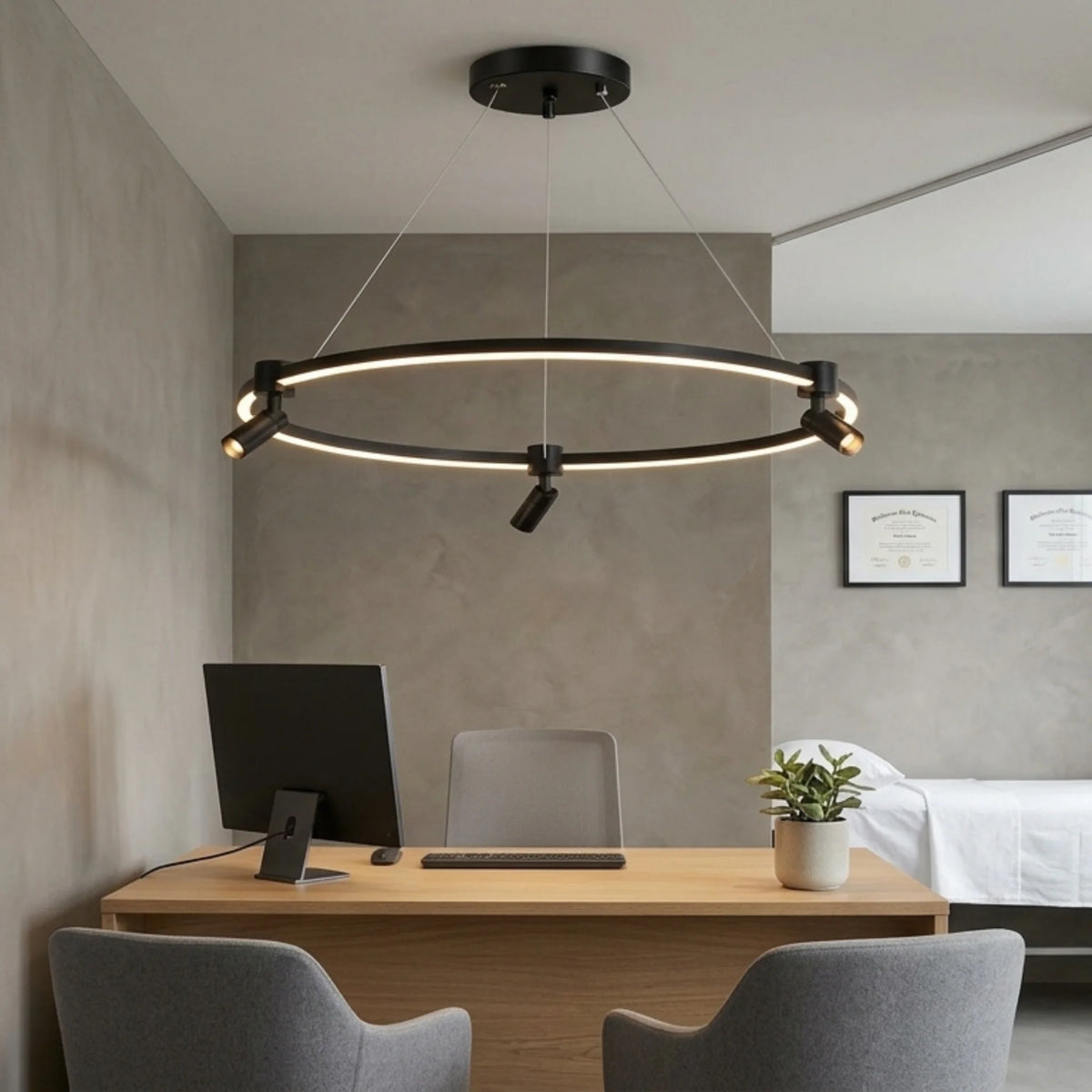 Lustre circulaire LED noir design suspendu dans une salle épurée