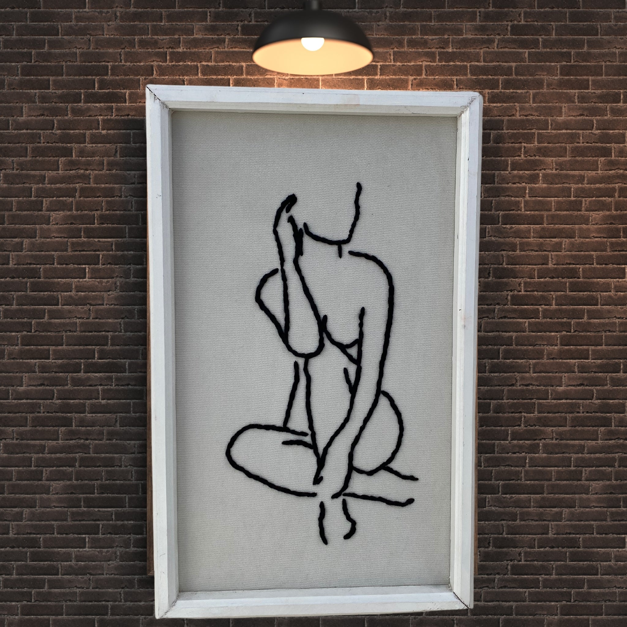 Art mural silhouette assise en coton tisse artisanal